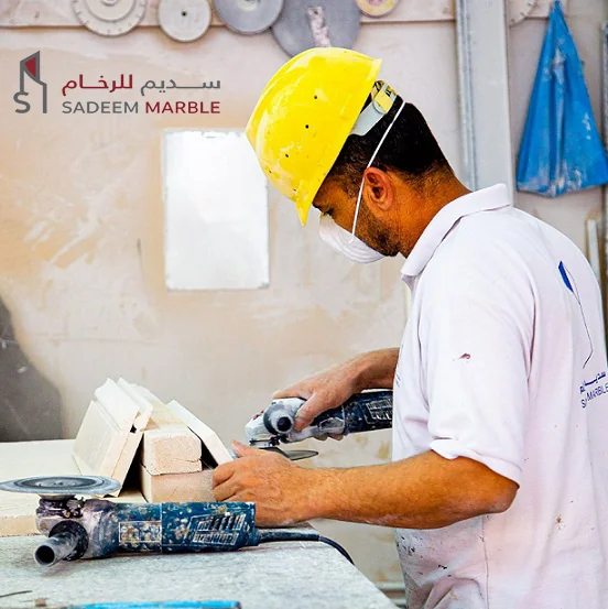 Sadeem Marble technician cutting and shaping natural stone at the company's Amghara factory